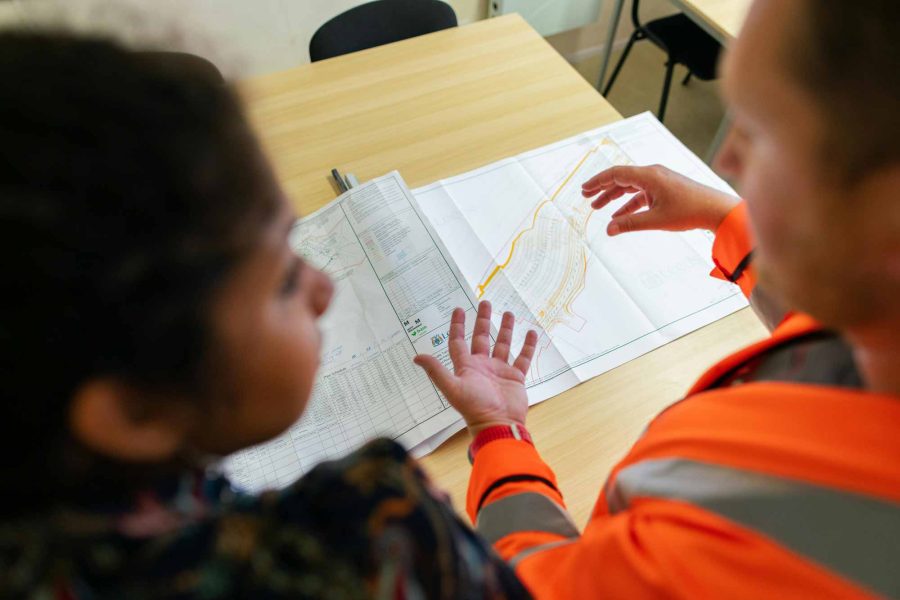 NCCS Group - Recruitment - Two engineers meeting over a set of plans